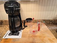 Overall lot: coffee maker, carafe, manual, brew basket, measuring cups