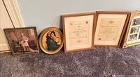 Group showing sepia portrait, Madonna print, two wood frames