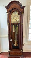 Full frontal view of Trend by Sligh walnut grandfather clock