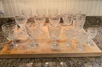 All 17 clear glass stemware pieces on cutting board