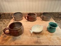 All six stoneware pieces on cutting board