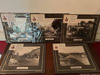 Five matted Irish village photographic prints displayed together