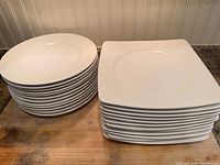 Stacks of round and square plates front view