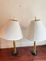 Pair of marble-base brass lamps with shades and finials