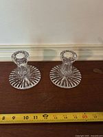 Full view of both Waterford crystal candlestick holders on tabletop