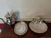 All four pieces grouped: teapot, scalloped dish, shell bowl with glass liner