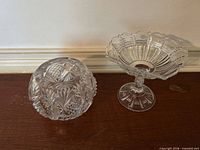 Pedestal compote bowl and covered bowl side by side on tabletop