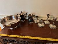 Group shot of all seven items on sideboard