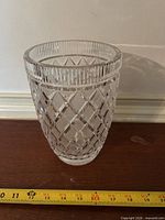 Side view showing full vase and tape for height