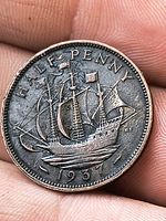 Reverse showing Golden Hind ship and date 1937