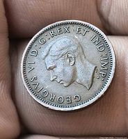 Obverse side showing King George VI portrait and legends