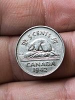 Reverse side of 1942 Canada 5-cent coin showing beaver design and date