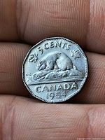 Reverse of 1954 Canadian 5-cent coin showing beaver and date