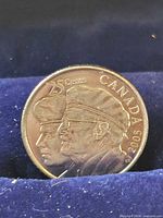 Reverse showing two veteran portraits and legends