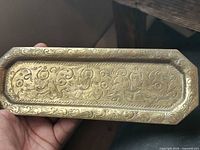 Top view of etched brass tray showing design and form