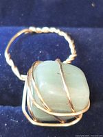 Front view of wire-wrapped ring with aventurine stone