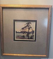 Frontal shot of framed print showing artwork, matting and gold frame