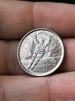 Reverse side with hockey player design and text