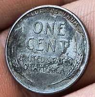 Reverse of 1943 steel one-cent coin showing wheat design and legends