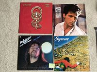 Front covers of all four LPs arranged in a 2x2 layout