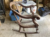 Left side view of mahogany rocking chair frame