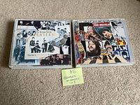 Front view of both Anthology CD sets showing cover artwork