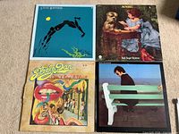 Front covers of all four LPs laid out