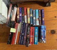 Top view showing roughly two dozen paperbacks standing upright