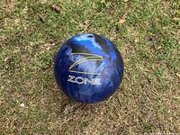 Top view of blue marbled Zone bowling ball showing logo