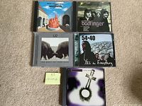 Front covers of all five CDs laid out