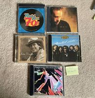 Front view showing five CD front covers