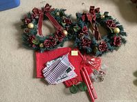 All items overview: 2 wreaths, fabric stack, 2 candles, bells bag, wire balls