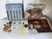 Group view of tray, wrappers, coins, booklet