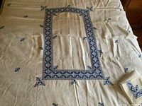 Full view of embroidered tablecloth spread out