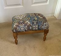 Full view of stool front and top upholstery