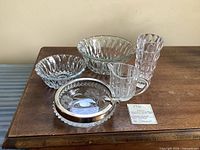 All five pressed glass items on table: chip bowl, dip bowl, vase, creamer, candy dish