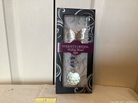 Front view of boxed Eternity Crystal Wishing Thread showing butterfly, bead, and crystal sphere