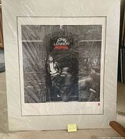 Front view of matted, shrink-wrapped lithograph