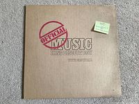 Front of corrugated cardboard LP sleeve showing album title and artist