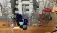 All glass containers grouped on floor