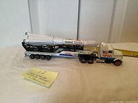 Side view of complete rocket on trailer with cab