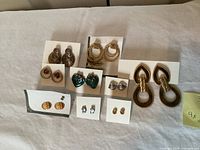 All nine pairs of earrings displayed on cards
