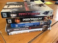 Stack showing all five boxed sets side profile