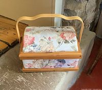 Closed floral sewing box showing exterior condition