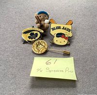 All four pins laid out with sticky note showing lot count