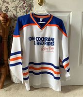 Front view of Tom Cochrane jersey showing graphic and stripes