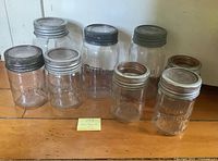 Eight Improved Corona jars in two sizes with mixed lids