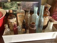 Tray containing entire group of vintage bottles