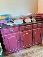 Full view of wood cabinet front with drawers and doors