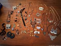 Entire lot laid out showing variety of necklaces, earrings, bracelets and accessories